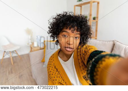 Happy African American Teen Girl Blogger Smiling Face Talking To Webcam Recording Vlog. Social Media