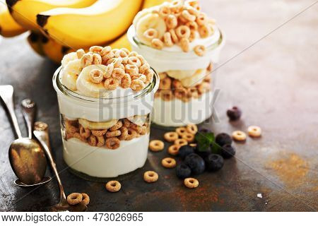 Yogurt Parfait With Cereal, Banana And Maple Syrup