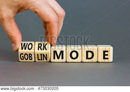 Work Or Goblin Mode Symbol. Concept Word Work Mode Goblin Mode On Wooden Cubes. Businessman Hand. Be