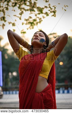Portrait Of A Pretty Young Indian Woman Wearing Traditional Saree And Jewellery With Spring Festive 
