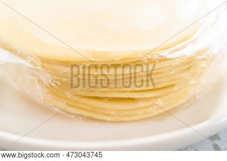 Flat Lay. Stack Empanada Dough On The Plate To Bake Turkey Empanadas.