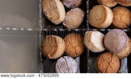Variety Of Spanish Shortbreads Mantecados, Polvorones, Nevaditos In Black Box. Typical Sweets Consum