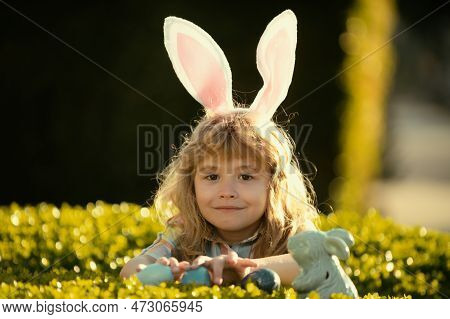 Child Boy With Easter Eggs Outdoor. Easter Egg Hunt. Fynny Kids Face. Happy Easter Day. Child With B
