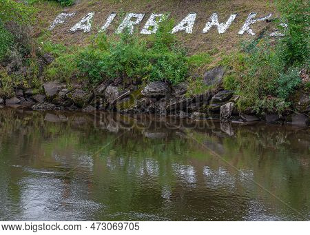 Fairbanks, Alaska, Usa - July 27, 2011: City Name Spelled Out With White Stones On Green Shoreline O
