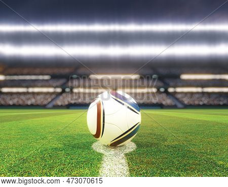 A Soccer Ball On The Centre Line Of A Soccer Stadium With Goals On A Marked Green Grass Pitch Under 