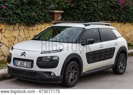 Side, Turkey - February 04 2023:     White Citroen C4 Cactus  Is Parked  On The Street On A Warm R D