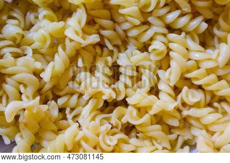 Fusilli Spaghetti, Fusilli Pasta As Background Image. Image Texture Spiral Macaroni. Top View. Copy,