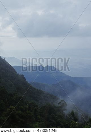Rain Bearing Monsoon Clouds Over Western Ghats Mountains In South India, In Late Summer Season