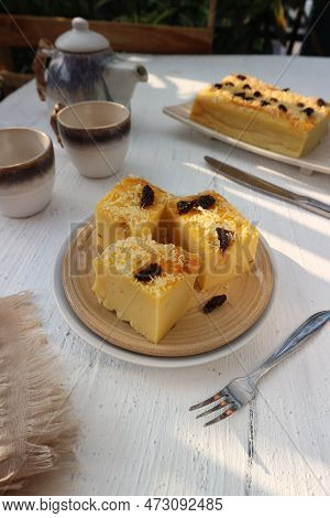 Cassava Cake With A Sprinkling Of Raisins And Cheese