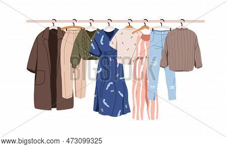 Women Clothes Hanging On Hanger Rail. Casual Female Wardrobe, Feminine Wearing On Rack. Modern Appar