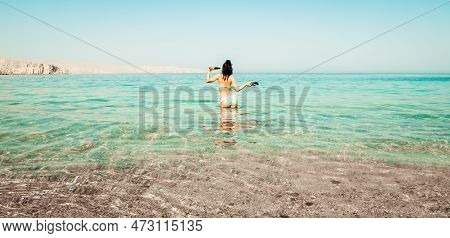 Tourist Woman Stand In Clear Turquoise Water In Persian Gulf Mirellas Island Sandy White Beach. Oman