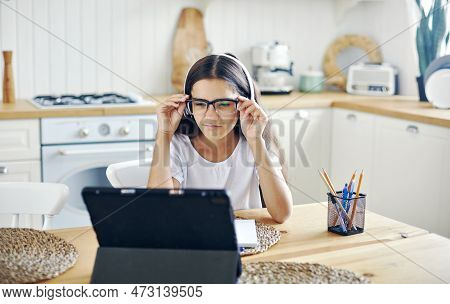Pretty Girl 12s Wear Headphones And Glasses Make Task, Studying Online, Experiences Vision Problems,