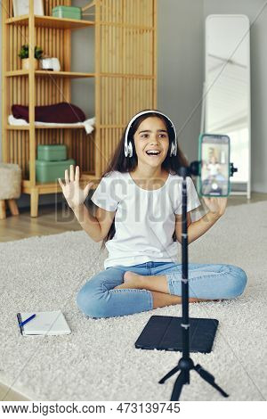 Pretty Preteen 12s Girl In Headphones Blogger Record Video For Vlog, Make Call, Lead Stream With Fri