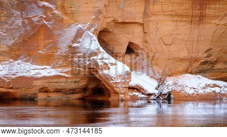 Red Sandstones On The Bank Of The River Salaca. Red Sandstone Rock In Bezdeligu Winter. Skanaiskalns