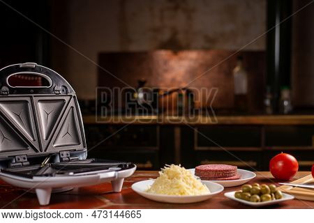 Pizza Waffles, Piffle. Waffles Stuffed With Sausage, Cheese, Tomatoes On A Plate.