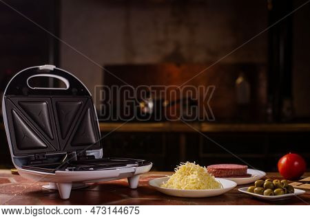 Pizza Waffles, Piffle. Waffles Stuffed With Sausage, Cheese, Tomatoes On A Plate.