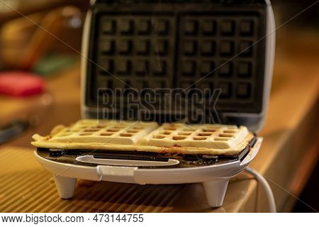 Cooking Waffles Stuffed With Sausage, Cheese. Pizza Waffle, Piffle.