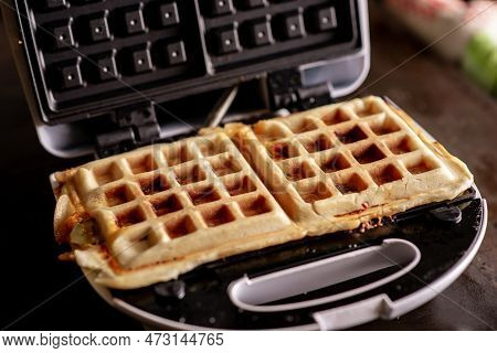 Cooking Waffles Stuffed With Sausage, Cheese. Pizza Waffle, Piffle. Open Waffle Iron.