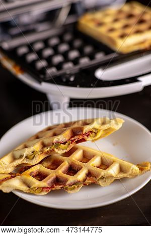 Pizza Waffles, Piffle. Waffles Stuffed With Sausage, Cheese, Tomatoes On A Plate.
