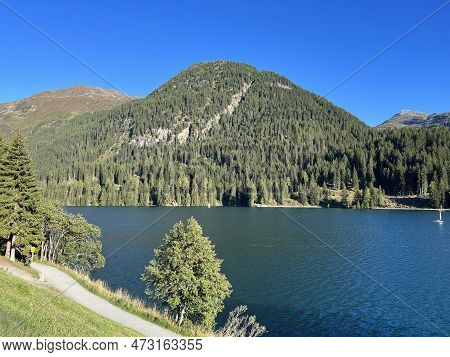 Sports And Recreational Trail Along The Alpine Lake Davos Or Loop Around Mountain Lake Davosersee, D