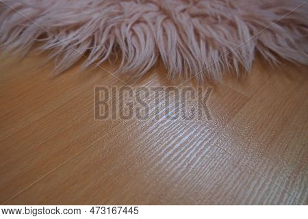 Long Pile Rug In Pink On A Beige Laminate Floor. Feminine Interior For A Room Or Bedroom Of A Girl O
