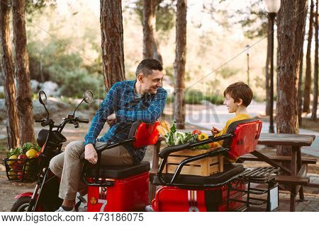 Farmer Father And School Boy Kid Delivered Wooden Crates With Vegetables To Camp Site For Picnic. Da