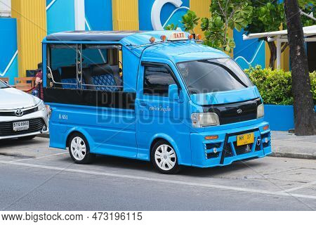 Parked Blue Hijet Pickup Truck Converted To Carry Passengers In The Back