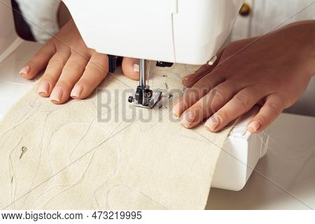 Unrecognizable Female Tailor Hands Putting White Fabric Textile Pattern With Stitch Contour On Sewin