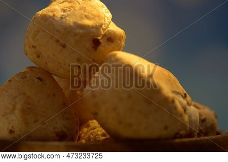 Extreme Close Up Of Authentic Chipa In A Rustic Wooden Bowl