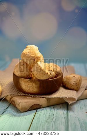Mouth-watering Chipa Bread In A Natural Wooden Bowl