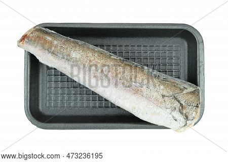 Uncooked Frozen Hake. Hake Hubbsi Without The Heads And Tails On A Black Plate Isolated On White Bac