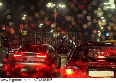 Traffic Jam On The Road In The Late Evening During A Rainstorm On The Front Window Of A Bad Weather 