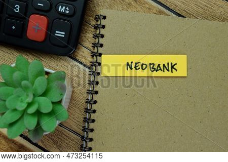 Concept Of Neobank Write On Sticky Notes Isolated On Wooden Table.