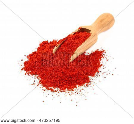 Close Up One Wooden Scoop Full Of Red Chili Pepper, Paprika Or Sundried Tomato Powder Spilled And Sp