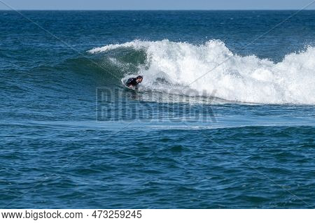 Bodyboarder Surfing Ocean Wave