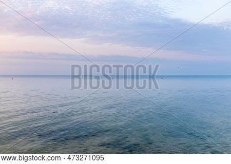 Background Of Sky And Sea, Sea Is Very Calm With Gentle Ripples, Sky Perfectly Clear. Calm Sea And B
