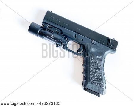 Bangkok Thailand - 21 March 2023: Air Soft Gun Glock 18C Pistol Gun With Flashlight Sight On The Whi