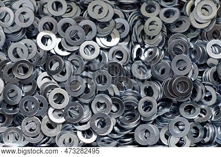 Bunch Of Stainless Steel Galvanized Flat Washers For Fastener Screws, Nuts Or Bolts, Hardware Backgr