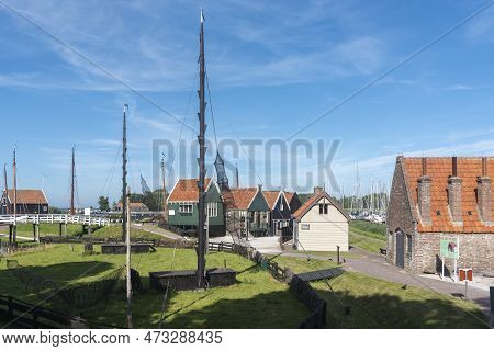 Enkhuizen, Netherlands - August 03, 2022: Ensemble With Historical Fishermen's Houses In The Zuiderz