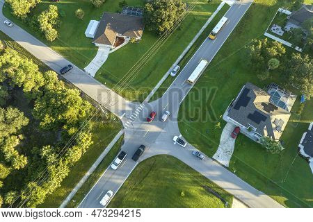 Top View Of Standard American Yellow School Bus Picking Up Kids At Rural Town Street Stop For Their 