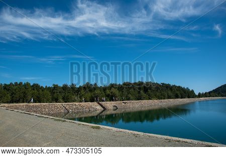 Panoramic View Of Dam Full Of Water In The Forest . Prodromos Water Reservoir Troodos Mountains Cypr