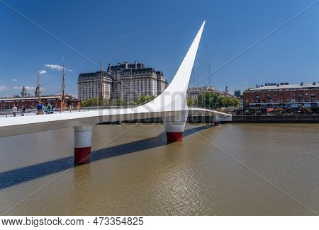 Buenos Aires, Argentina - 7 February 2023: Woman Bridge Footbridge Leading To Downtown In Puerto Mad
