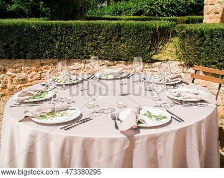 Wedding Banquet Concept. Chairs And Round Table For Guests, Served With Cutler And, Flowers And Croc