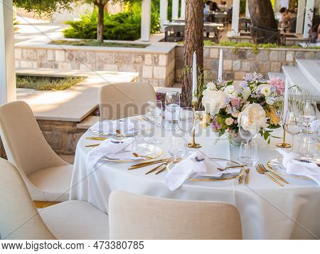 Wedding Banquet Concept. Chairs And Round Table For Guests, Served With Cutler And, Flowers And Croc