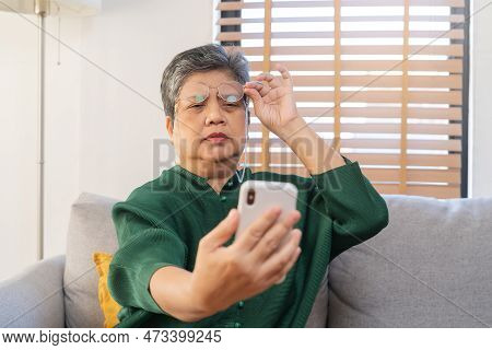 Presbyopia, Hyperopia Mature Asian Woman Holding Eyeglasses Having Problem With Vision Problem Tryin
