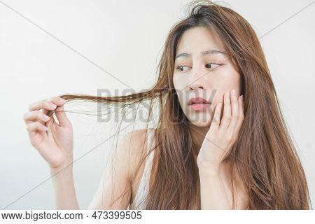 Damaged Hair, Frustrated Asian Young Woman, Girl Hand In Holding Splitting Ends, Messy Unbrushed Dry