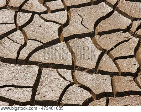 Dry And Cracked Soil Or Sediment Of The Treatment Pond
