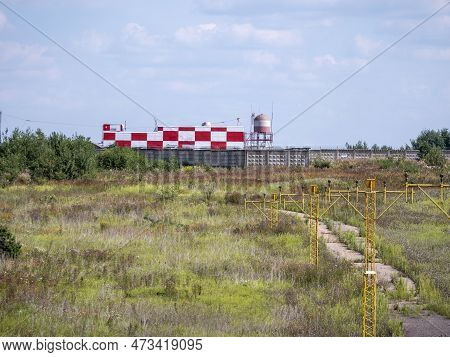 Yellow Metal Support Systems Of Care During Takeoff And Landing Direction Light Near Runway.