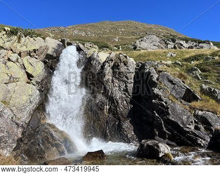 Mountain Waterfalls And Cascades Of Alpine Stream Ova Da Radönt (ova Da Radoent) Above The Swiss Roa