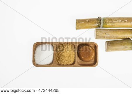 White Sugar, Brown Sugar And Sugar Cane Panela On White Background